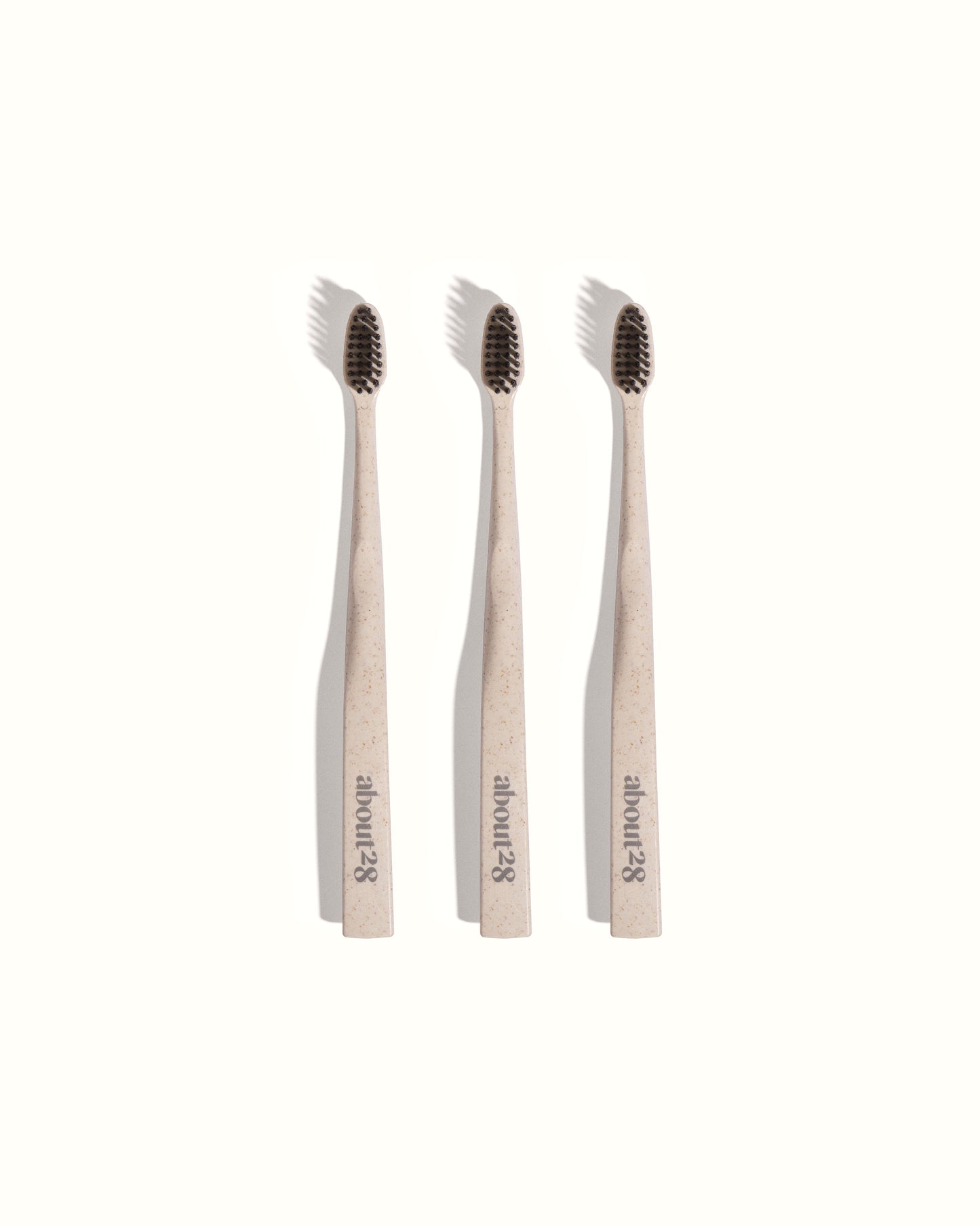 stylish stone coloured toothbrushes with black bristles