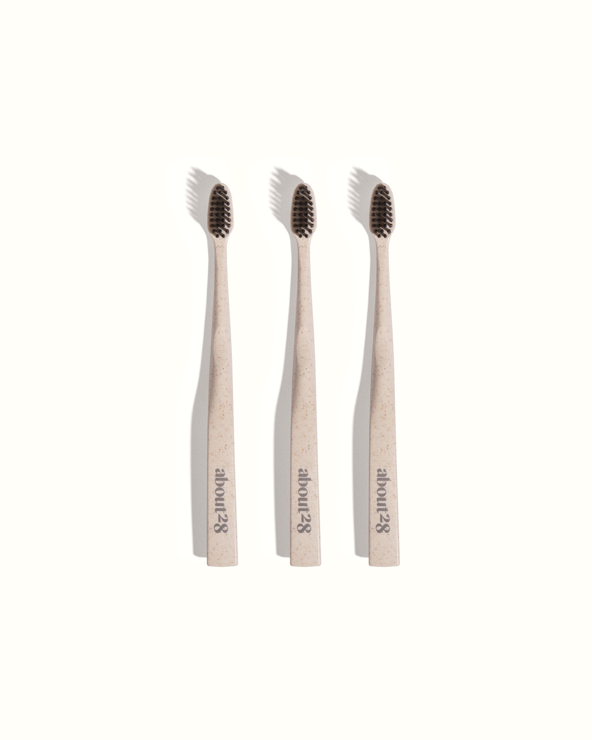 stylish stone coloured toothbrushes with black bristles