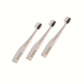 three stylish stone coloured toothbrushes with black bristles